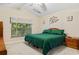 Comfortable main bedroom with a king-size bed, large window, and ceiling fan at 544 Running Deer Trail, Myrtle Beach, SC 29588