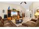 Bright living room featuring hardwood floors, a fireplace, and built-in entertainment center at 544 Running Deer Trail, Myrtle Beach, SC 29588