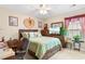 Second bedroom with a queen bed, window seat and adjacent desk space at 544 Running Deer Trail, Myrtle Beach, SC 29588