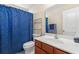 Clean bathroom with a shower/tub combo, toilet, and vanity with wood cabinets at 544 Running Deer Trail, Myrtle Beach, SC 29588