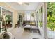 Bright sunroom with sliding doors, comfy seating, and exercise bike at 544 Running Deer Trail, Myrtle Beach, SC 29588