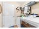 Functional laundry room with washer, dryer, and overhead shelving at 544 Running Deer Trail, Myrtle Beach, SC 29588