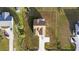 Top-down view of a home with a driveway and surrounding lawns in a residential neighborhood at 1727 Cane Branch Rd., Loris, SC 29569