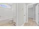 Bright bathroom with white fixtures and a view to a bedroom at 1727 Cane Branch Rd., Loris, SC 29569