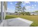 Large backyard with patio and partial view of neighboring properties at 1900 Blue Bird Rd., Loris, SC 29569