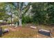 Landscaped backyard with pond and trees at 129 Board Landing Circle, Conway, SC 29526