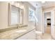 Modern bathroom with granite countertop, updated fixtures, and a view of the kitchen at 615 1St Ave. N, Surfside Beach, SC 29575