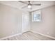 Spacious bedroom with ceiling fan, double closet and wood-look flooring at 615 1St Ave. N, Surfside Beach, SC 29575