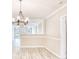 Open concept dining area showcasing hardwood floors and a chandelier at 615 1St Ave. N, Surfside Beach, SC 29575