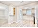 Renovated kitchen with white cabinets, granite counters, and stainless steel appliances at 615 1St Ave. N, Surfside Beach, SC 29575