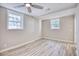 Spacious bedroom with hardwood floors and ceiling fan at 615 1St Ave. N, Surfside Beach, SC 29575