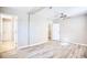 Well-lit bedroom with hardwood floors and access to bathroom at 615 1St Ave. N, Surfside Beach, SC 29575