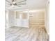 Hardwood floor dining room with a chandelier and adjacent living area at 615 1St Ave. N, Surfside Beach, SC 29575