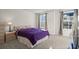 Bright bedroom with a double bed, carpet, and two windows at 300 Golan Circle # C, Myrtle Beach, SC 29579