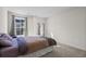 Bedroom with double bed, carpet, and two windows with curtains at 300 Golan Circle # C, Myrtle Beach, SC 29579