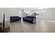 Open living room features hardwood floors and a view into the kitchen at 508 Shellbark Dr., Longs, SC 29568