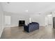 Open living area with wood-look floors and access to other rooms at 508 Shellbark Dr., Longs, SC 29568