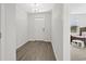 Light and airy entryway with view to living area at 508 Shellbark Dr., Longs, SC 29568