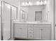 Modern bathroom with double vanity and a walk-in shower at 508 Shellbark Dr., Longs, SC 29568