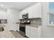Kitchen features granite countertops and white cabinets at 508 Shellbark Dr., Longs, SC 29568