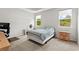 Bright bedroom with two windows, carpeted floors, and a workspace at 508 Shellbark Dr., Longs, SC 29568