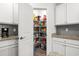 Well-stocked pantry with ample shelving for storage at 508 Shellbark Dr., Longs, SC 29568
