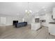 Combined kitchen and living area with hardwood floors and an island at 508 Shellbark Dr., Longs, SC 29568