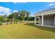 Spacious backyard with grassy lawn and view of street at 508 Shellbark Dr., Longs, SC 29568