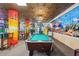 Game room with a pool table and ocean mural at 205 N 74Th Ave. N # 1106, Myrtle Beach, SC 29572