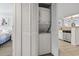 Compact laundry closet with stacked washer and dryer at 205 N 74Th Ave. N # 1106, Myrtle Beach, SC 29572