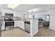 Modern kitchen with stainless steel appliances and granite counters at 205 N 74Th Ave. N # 1106, Myrtle Beach, SC 29572