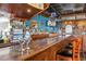 Full bar with a variety of liquor and seating at 205 N 74Th Ave. N # 1106, Myrtle Beach, SC 29572