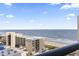 Balcony with ocean view and chairs at 205 N 74Th Ave. N # 1106, Myrtle Beach, SC 29572