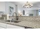 Kitchen features granite countertops, a stainless steel sink, and a modern faucet at 205 N 74Th Ave. N # 1106, Myrtle Beach, SC 29572