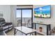 Living room with ocean view, comfy seating and large TV at 205 N 74Th Ave. N # 1106, Myrtle Beach, SC 29572