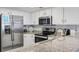 Modern kitchen featuring stainless steel appliances and granite countertops at 205 N 74Th Ave. N # 1106, Myrtle Beach, SC 29572