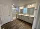 Modern bathroom with double vanity, shower, and new flooring at 240 Goose Pond Dr., Myrtle Beach, SC 29579