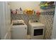 Laundry room with washer, dryer, and shelving at 9606 Indigo Creek Blvd., Murrells Inlet, SC 29576