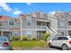 Gray condo building with red roof and landscaping; cars parked in front at 4396 Baldwin Ave. # 45, Little River, SC 29566