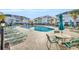 Community pool with lounge chairs and umbrellas at 800 Crumpet Ct. # 1119, Myrtle Beach, SC 29579