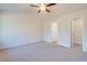 Spacious bedroom with ceiling fan and ample closet space at 807 Busy Corner Rd., Conway, SC 29527