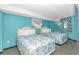 Bedroom with two twin beds and coastal decor at 7100 N Ocean Blvd. # 218, Myrtle Beach, SC 29572