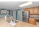Kitchen with granite countertop, stainless steel appliances, and wood cabinets at 7100 N Ocean Blvd. # 218, Myrtle Beach, SC 29572