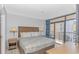King-size bed, balcony access, and a dresser at 5308 N Ocean Blvd. # 1115, Myrtle Beach, SC 29577