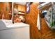 Laundry area with washer, dryer, and wood paneling at 4305 S Ocean Blvd. # 205, North Myrtle Beach, SC 29582