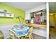 Cozy dining area with a small table and chairs, adjacent to the kitchen at 4305 S Ocean Blvd. # 205, North Myrtle Beach, SC 29582