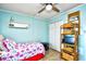 Bedroom with twin-size bed, built-in shelving, and ample closet space at 4305 S Ocean Blvd. # 205, North Myrtle Beach, SC 29582