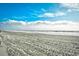 Expansive beach view with blue sky and clouds at 4305 S Ocean Blvd. # 205, North Myrtle Beach, SC 29582