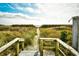 Beach access path with boardwalk and outdoor shower at 4305 S Ocean Blvd. # 205, North Myrtle Beach, SC 29582