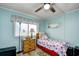 Light and airy bedroom with twin-size bed and built-in shelving at 4305 S Ocean Blvd. # 205, North Myrtle Beach, SC 29582